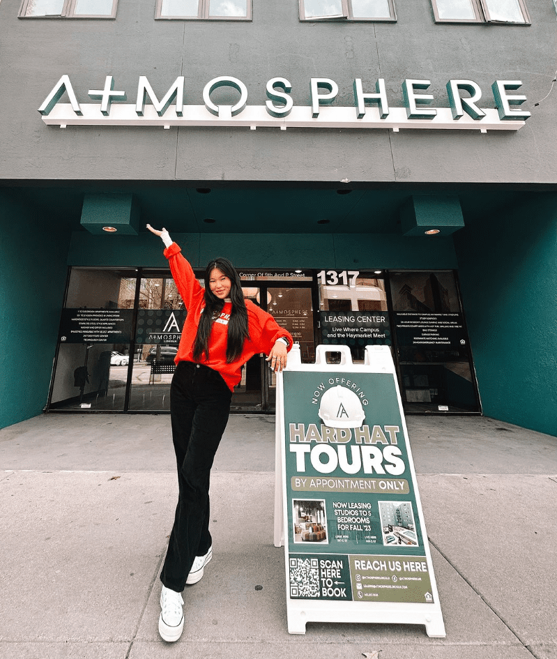 Woman posing outside of a building
