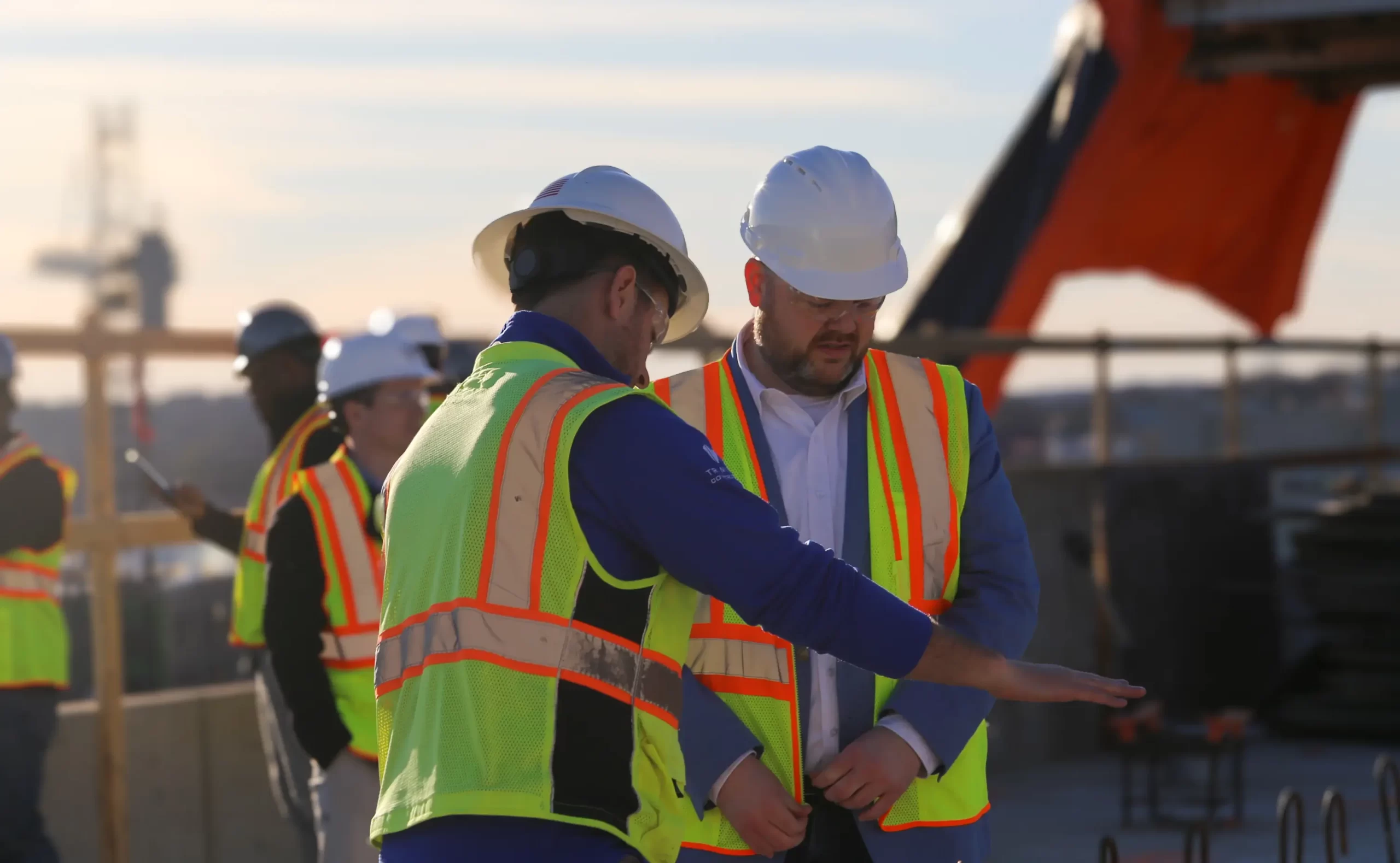 two construction workers talking