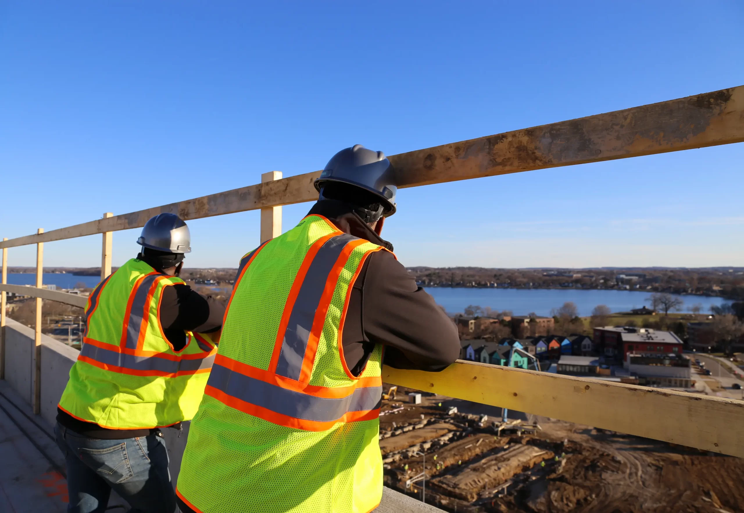 construction workers overlooking a city