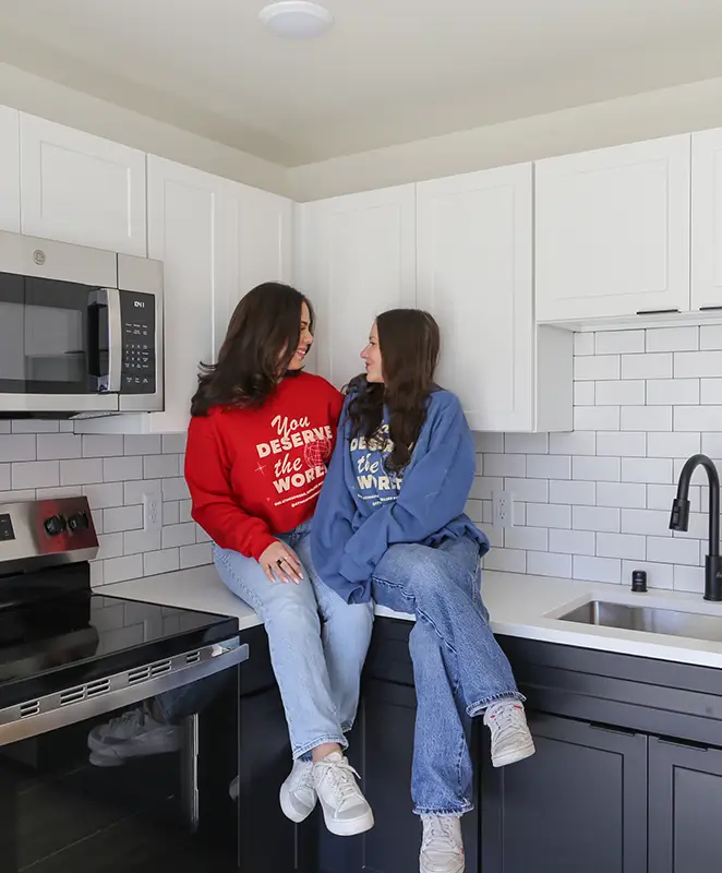 residents sitting in a kitchen